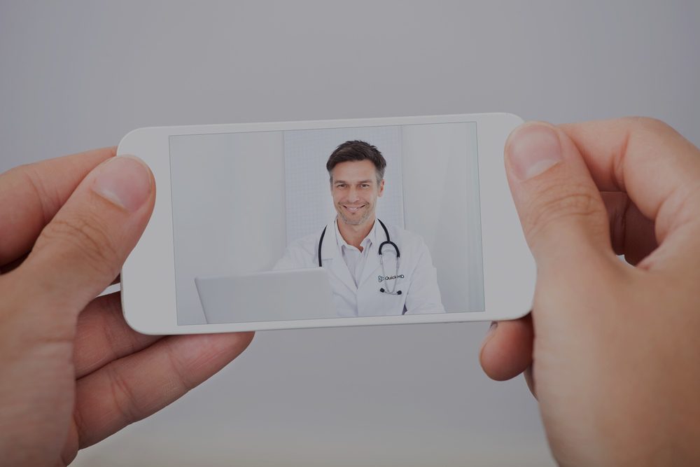 Doctor speaking with a patient via telehealth