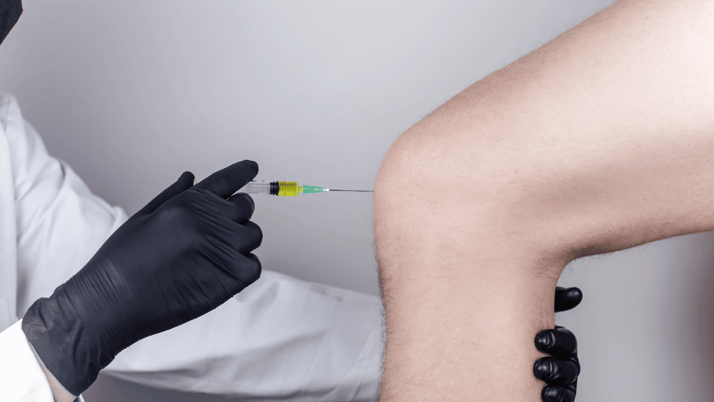 Doctor injecting Prednisone, dexamethasone, and methylprednisolone into a patient's knee