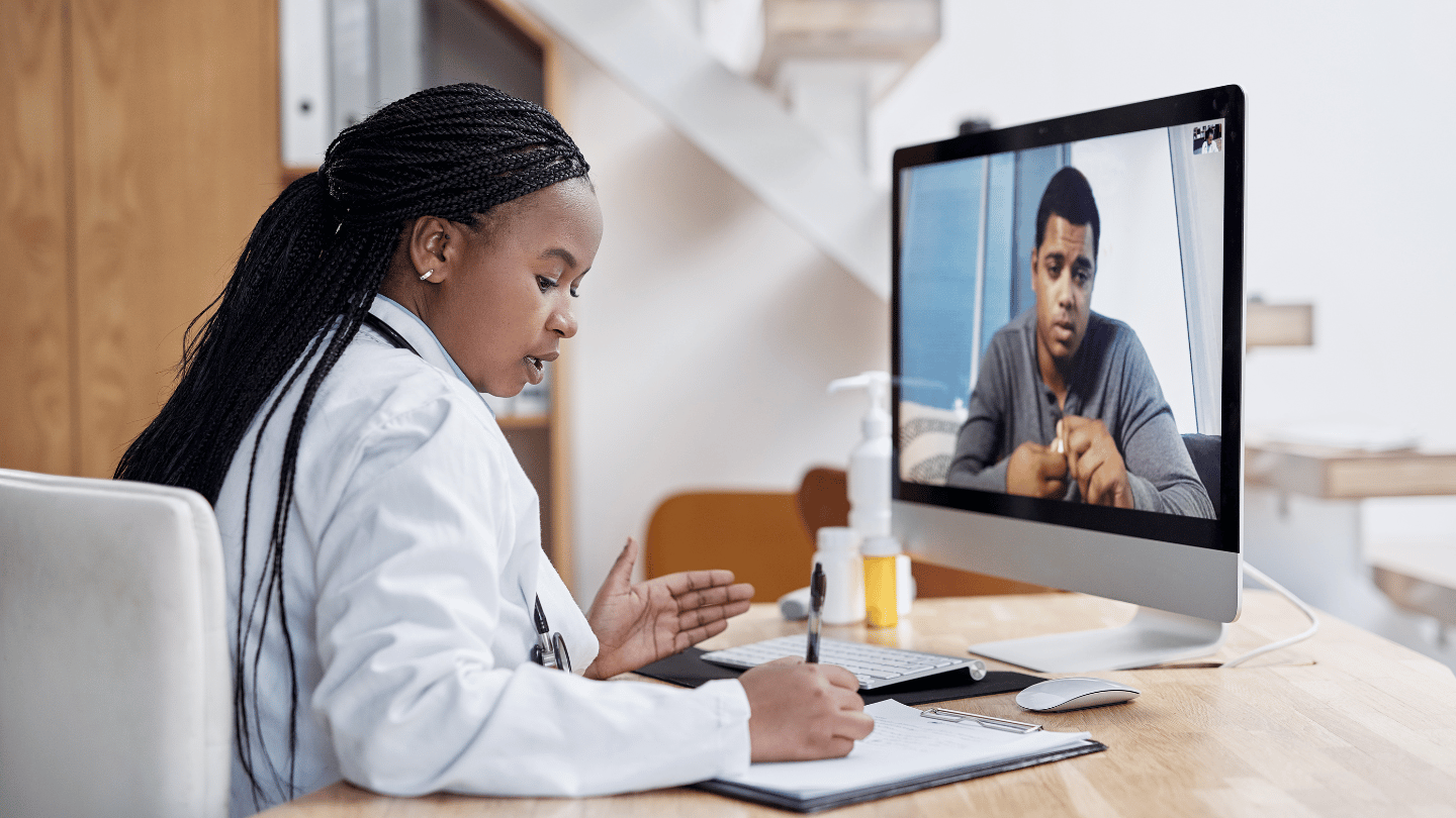 QuickMD doctor meeting with a patient to write a doctor's note via telehealth