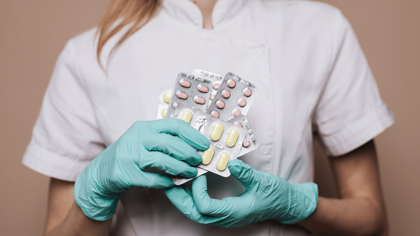 Doctor holding antibiotics for bronchitis