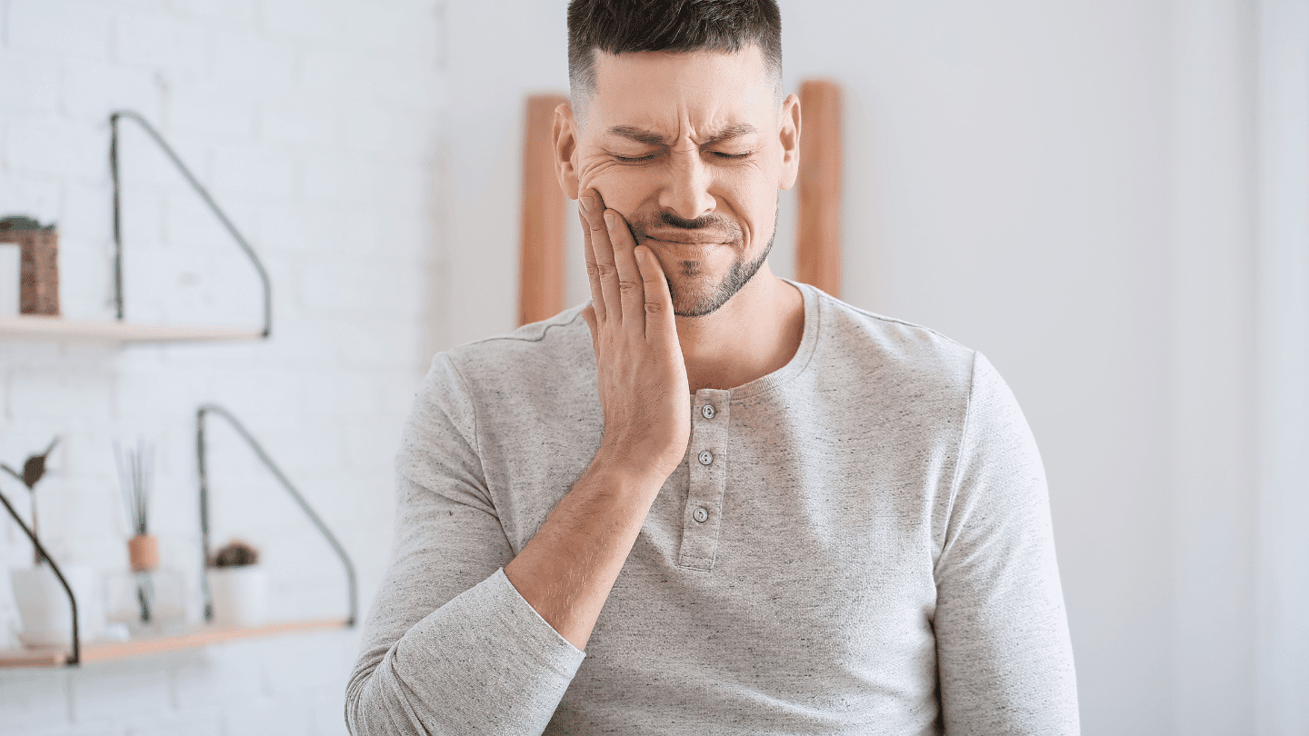 Man experiencing tooth pin in need of Antibiotics for Tooth Infections