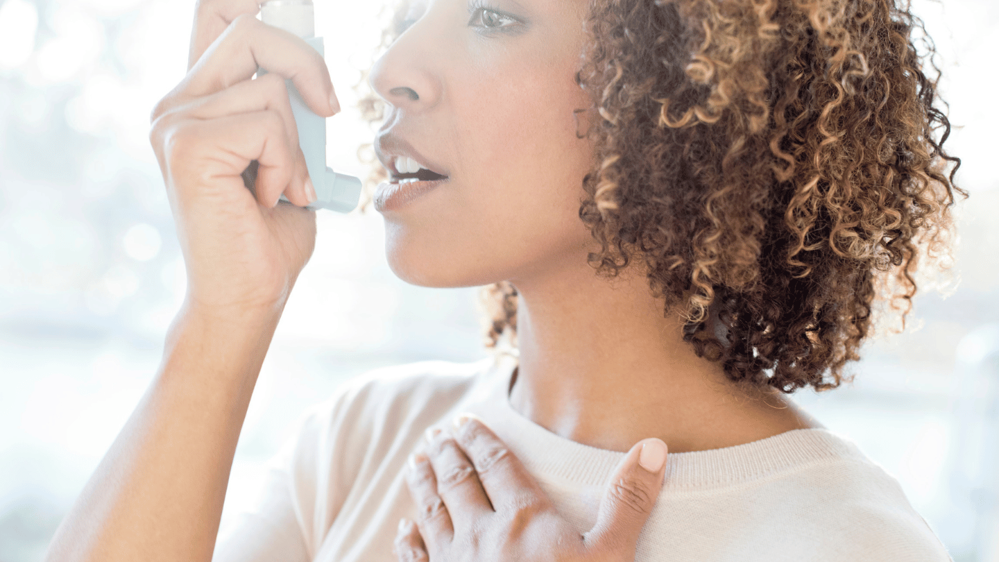 Woman using albuterol inhaler from online prescription