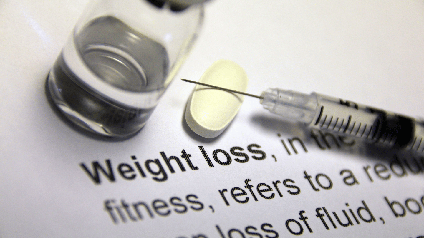 Weight loss injections on a paper saying 'weight loss'