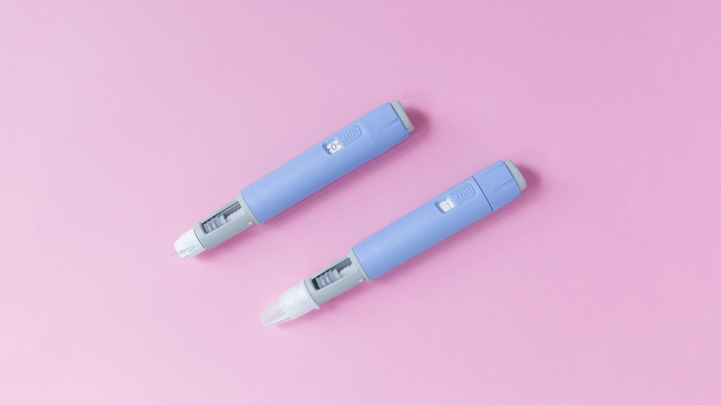 Two Ozempic injection pens on a pink background, representing the weekly dosing schedule for managing type 2 diabetes and aiding weight loss