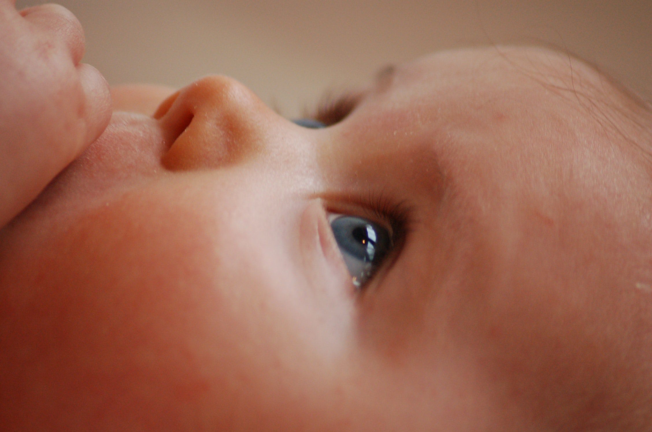 Closeup of an infant's face after breastfeeding