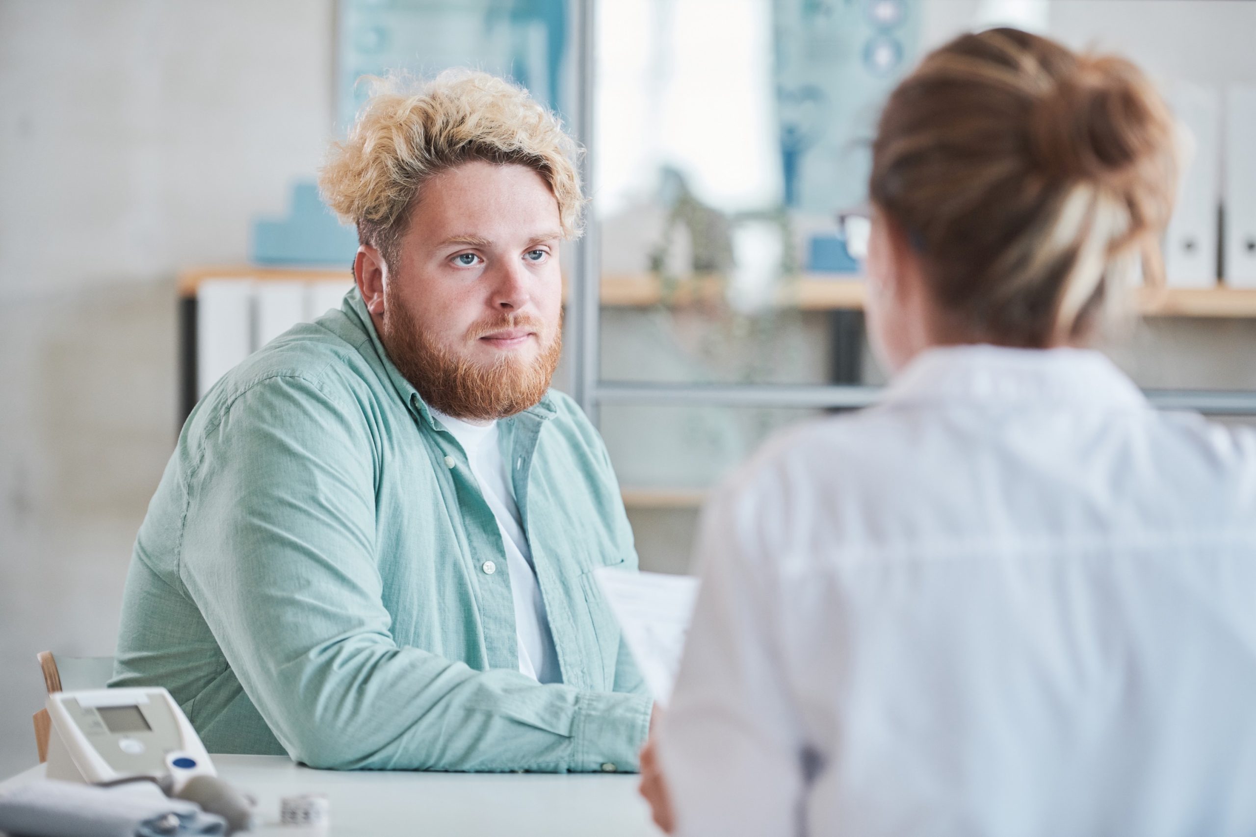 Man meeting with QuickMD doctor to discuss weight stigma, obesity, and weight loss medication