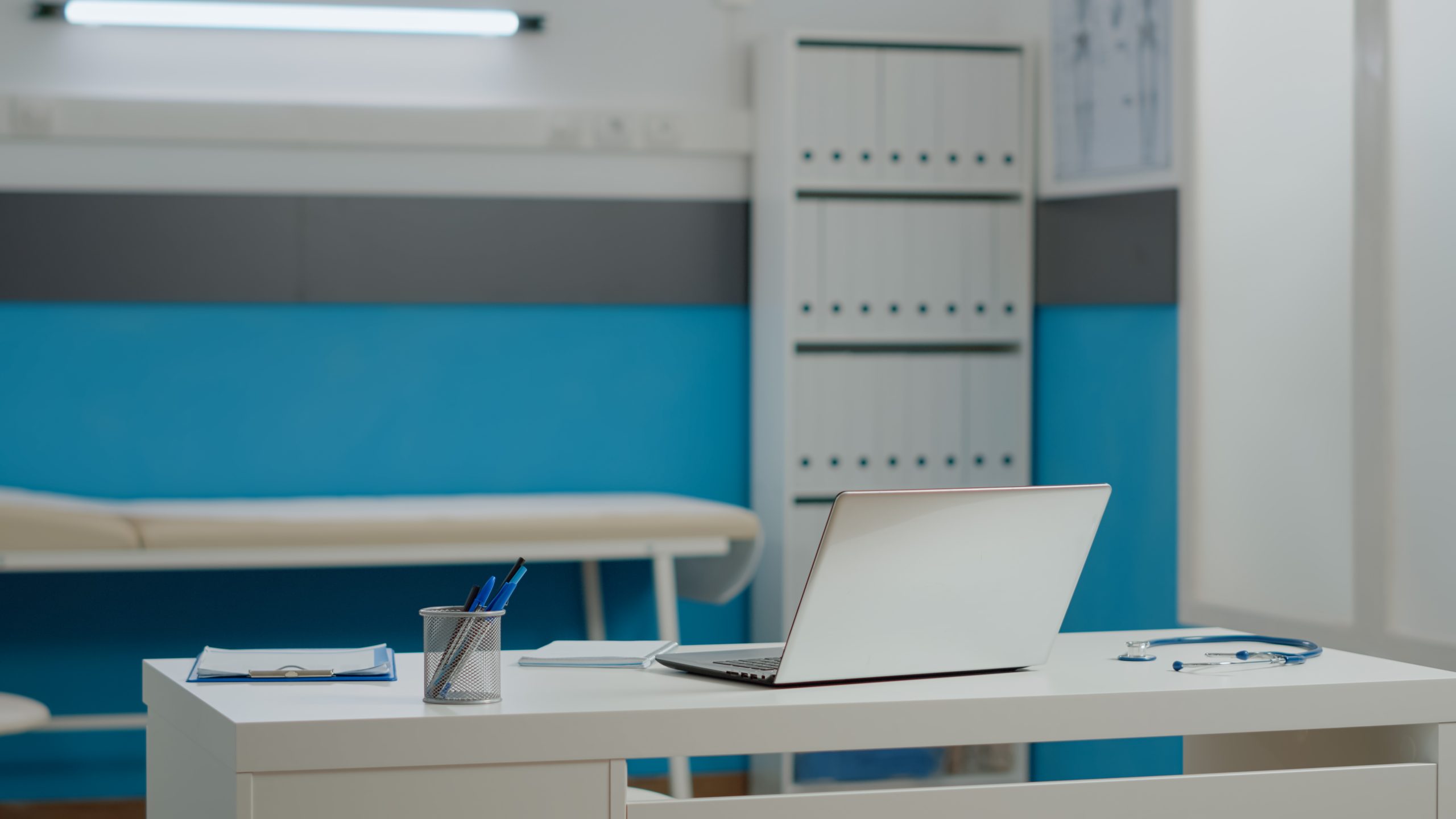 Office with open laptop to access tele health services