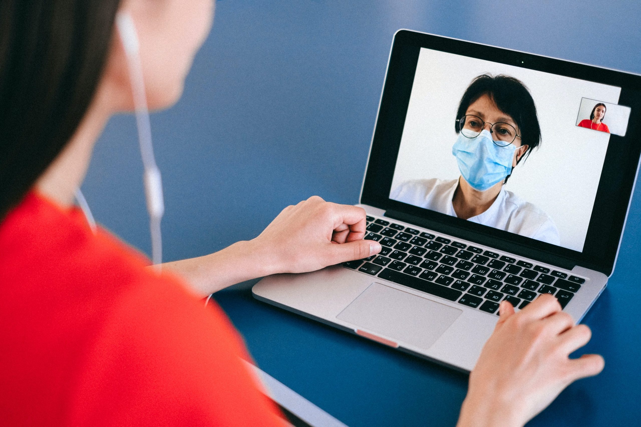 Woman meeting with a QuickMD telemedicine doctor about IBS vs IBD